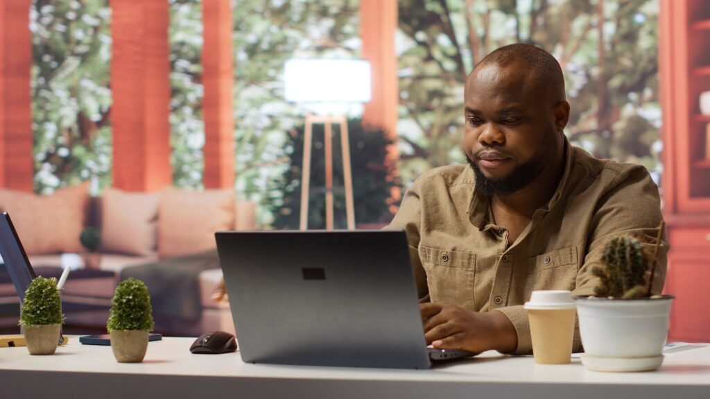 freelancer using his laptop to manage business analytics and financial planning